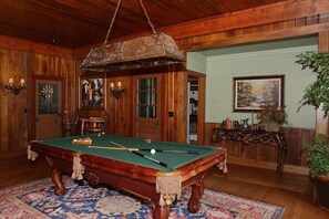 Old Fashion pool table and dart board area off of the great room