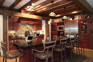 Large kitchen with open bar seating 6