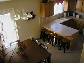 Kitchen and One Of The Dining Areas.  Fully stocked for 24 people.