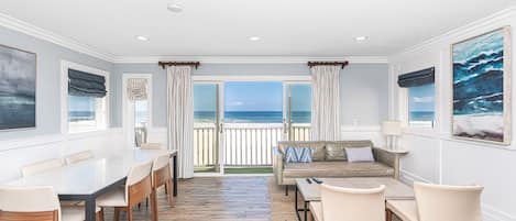 This upstairs unit is elegant yet relaxed, with every design detail inspired by the coastal surroundings. Interior spiral staircase provides access to upper unit from the ground level entry door.
