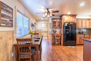 Dining table with chairs and bench for family style seating.