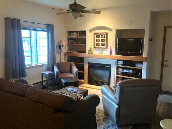 Living area with queen sleeper sofa.