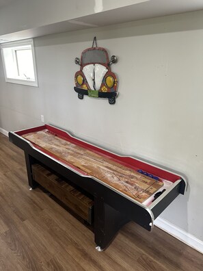 Shuffleboard and accessories in the basement