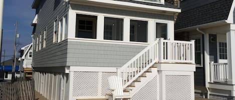 Ocean side, front of cottage note upstairs glass-fronted porch to view ocean.