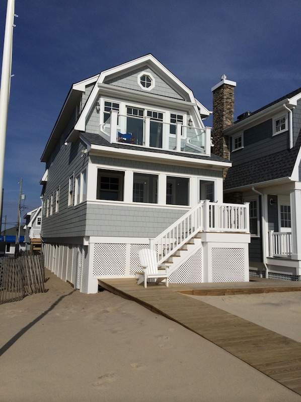 Ocean side, front of cottage note upstairs glass-fronted porch to view ocean.