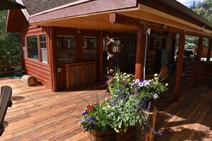 Large portion of deck is covered to find shade or escape brief rain shower.