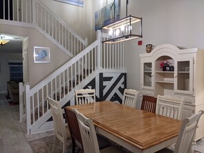 Dining Room with seating for 8. New, modern chandelier.