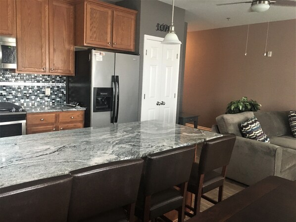 Beautiful New Granite & Tiled Backsplash