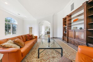 Living room, main foyer on the other side of archway