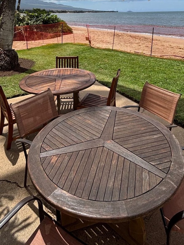 Oceanfront patio dining area. April 2025 - replaced sod is now usable.