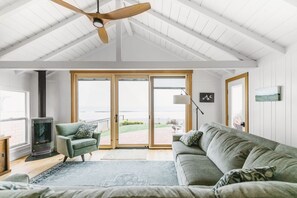 The living room, new furniture welcomes you to sit and watch the ocean show!