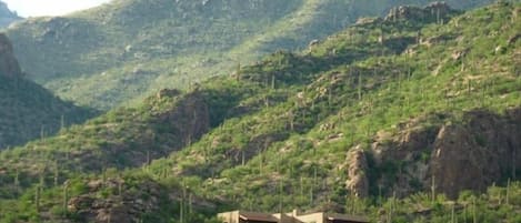 View from Ventana Canyon golf course. House is on a lot carved in the mountain. 