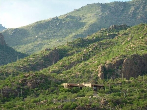 View from Ventana Canyon golf course. House is on a lot carved in the mountain. 