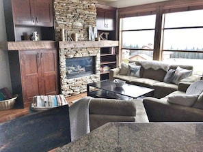 Large open main with entry, bath kitchen, dining, living and hot tub access.