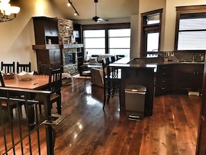 Large open main with entry, bath kitchen, dining, living and hot tub access.