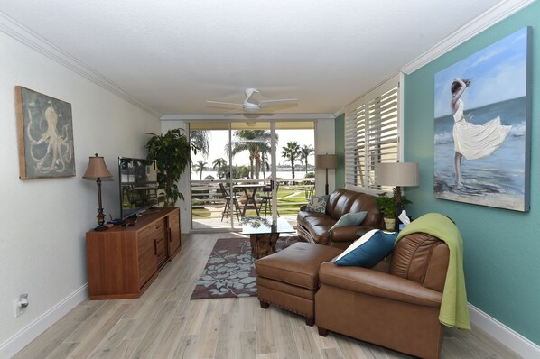 Bright comfortable living room with direct waterfront view