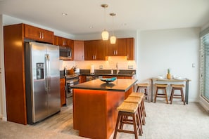 Beautifully designed kitchen with stainless steel appliances.