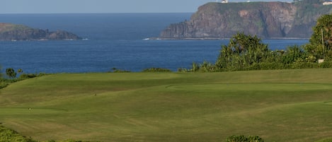 View from lanai across golf course to Kilauea lighthouse