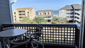 Relax on the covered 3rd floor balcony while enjoying the sounds of the ocean.