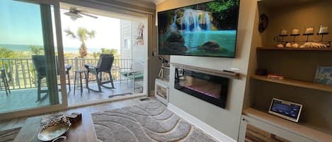 Double slider doors connect the main deck to the living room.