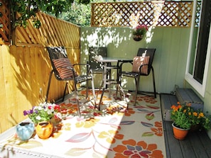 Dappled sun on private deck outside your bedroom's sliding doors