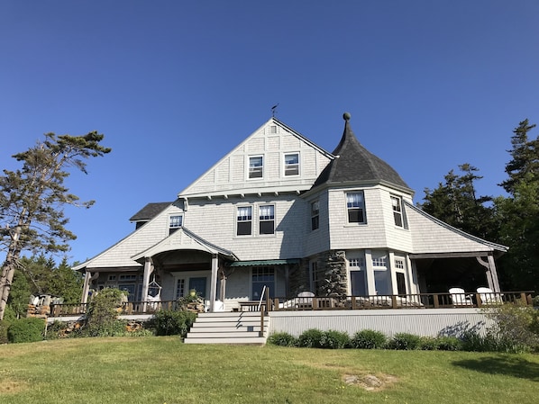 Front view of the house and wrap around deck