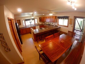 Large fully stocked kitchen & dining room area, more than enough room for 8. 