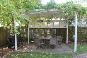 Pergola w/ Large Circular Table, Propane and Charcoal Grills in Fenced in Yard