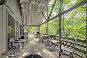 Come sit on the covered deck overlooking Historic Lake Rabun
