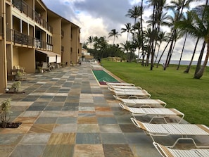 Ground floor lanai replaced in 2016 with beautiful quartzite & new shuffleboard.