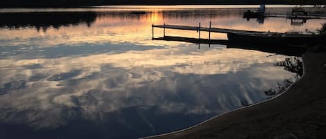 Sunset from private dock area (note: due to varied lake levels sand area varies)