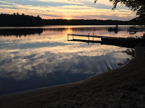 Sunset from private dock area (note: due to varied lake levels sand area varies)