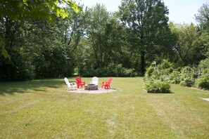 Large acre yard in back, very private, surrounded by mature Tulip Trees!