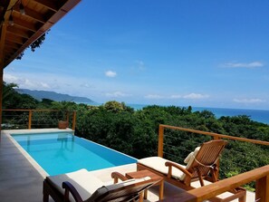 Pool and lounge chairs, incredible view