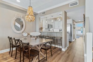 Interior dining includes dining table with seating for 6 plus 4 barstools.