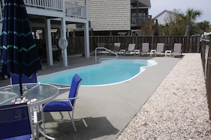 Private pool with privacy fence and a lot of outdoor seating