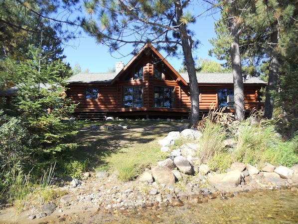 Log sided lakehome is located on the water's edge