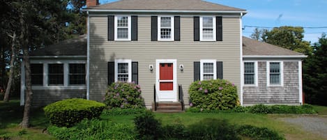 Front of house showing enclosed porch (L), 