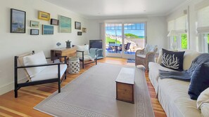 Comfortable family room with flat screen TV and Cape Cod Bay views