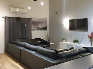 Rumpus room with huge leather modular suite and pool table and new 85"tv