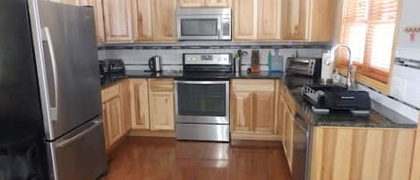 Kitchen is  well equipped to prepare big family meals, or  to grab a quick bite.