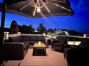 Roof top deck seating and umbrella with lights