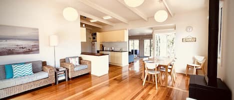 Kitchen, dining and first living area, looking through to main living area