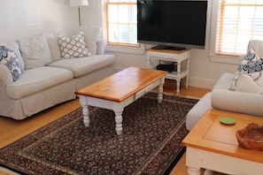 First floor sunroom with TV.