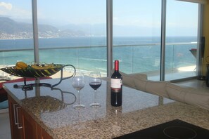 Sip a glass of wine in front of the stunning ocean!