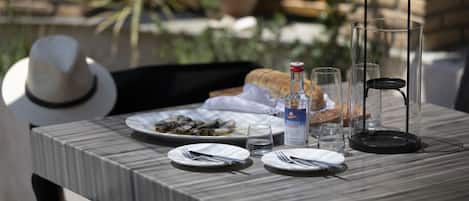 Greek ouzo with typicall greek meze at the courtyard