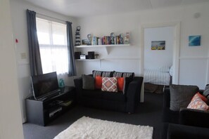 Comfortable couches with reading material, games and puzzle.