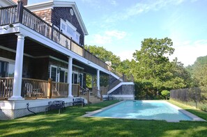 Back view: Two story decks and large swimming pool  