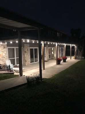 View of your entrance at night. This patio overlooks the cove. Lights on a timer