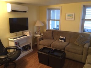 Flat screen TV, DVD player, and plenty of room to relax in the living room.